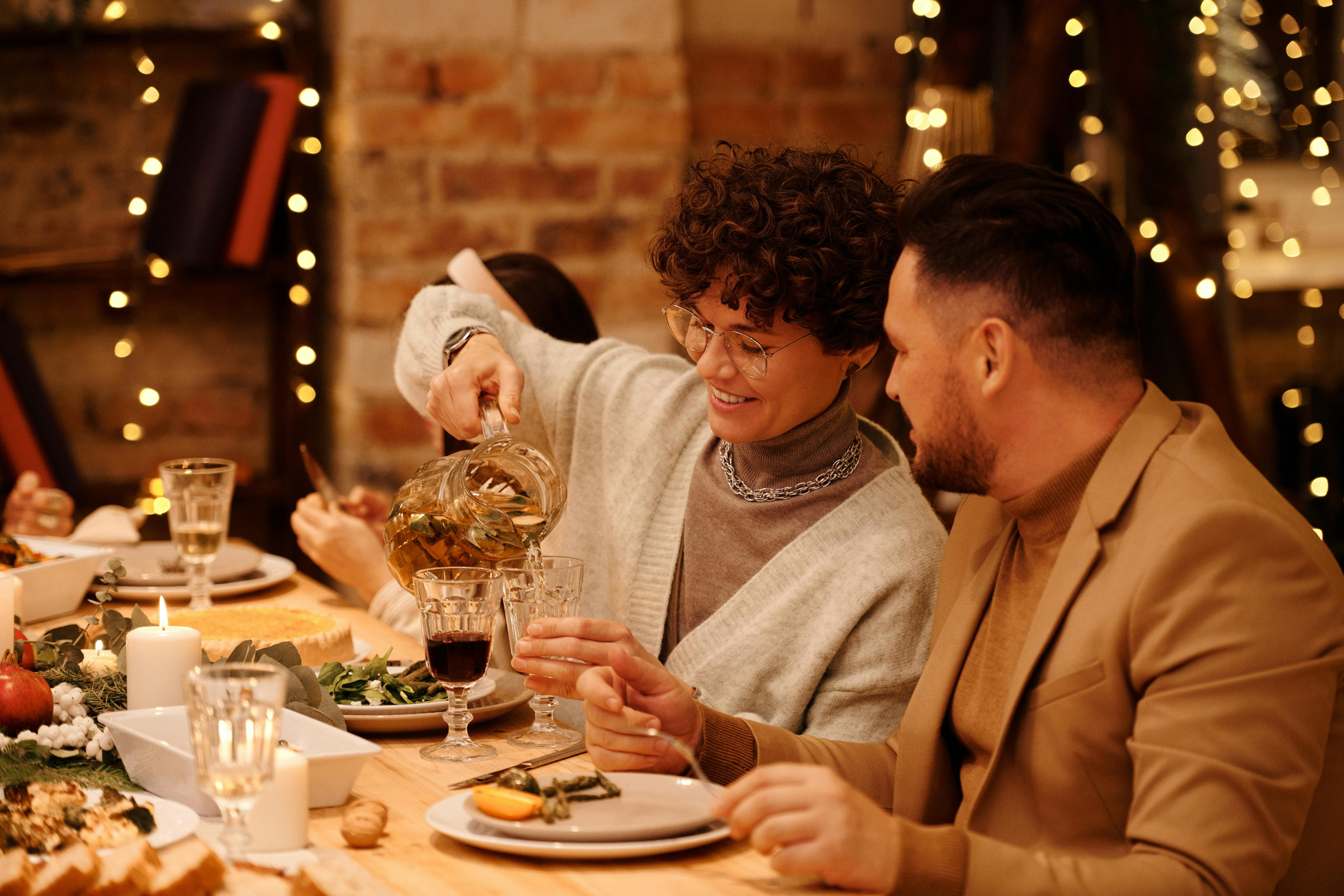 Guests enjoying dinner in a warm restaurant setting